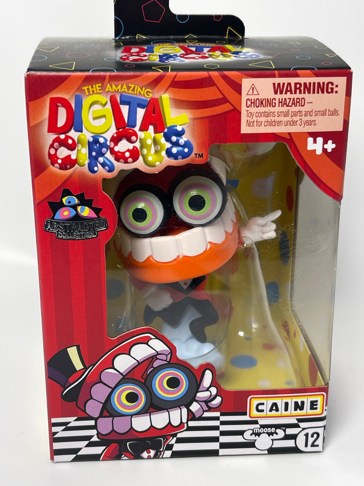 Toy packaging with a colorful character and warning label on a white background
