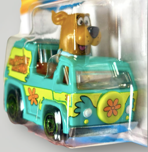 Toy vehicle in packaging with a cartoon character on top