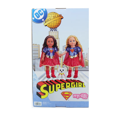 DC Comics 'My Life As A Supergirl' doll set in its original retail packaging, featuring two dolls dressed as Supergirl with a small white dog on the box art.