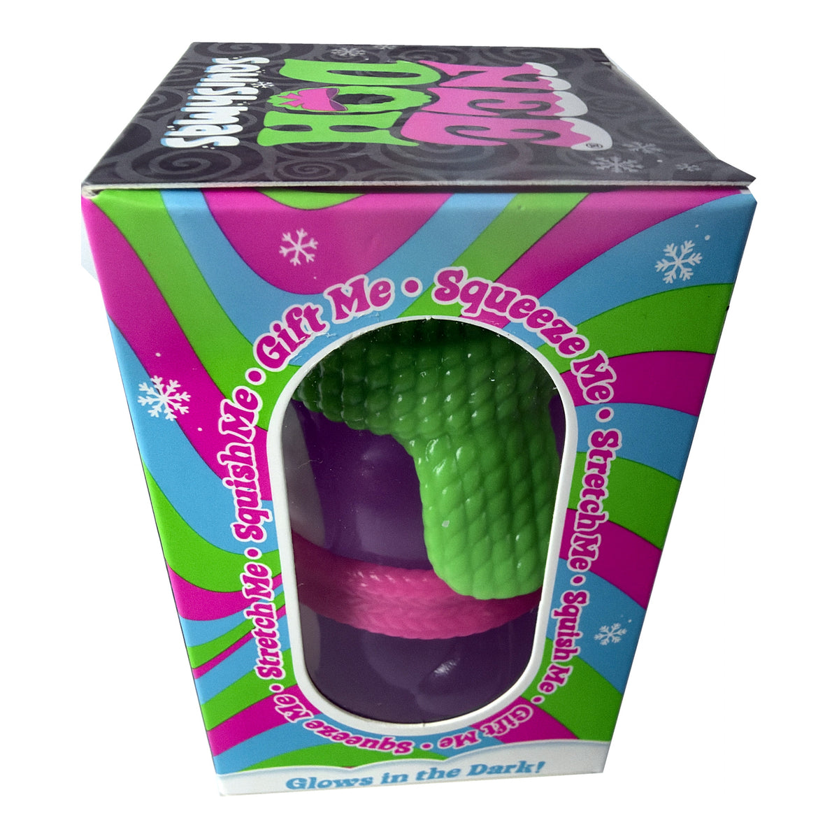 A boxed novelty toy labeled 'Squishy Me' with a visible green textured squishy ball inside a colorful retail box. The box has pink, blue, and green striped sides, a black top panel, and text including 'Gift Me • Squeeze Me' and 'Glows in the Dark!'.