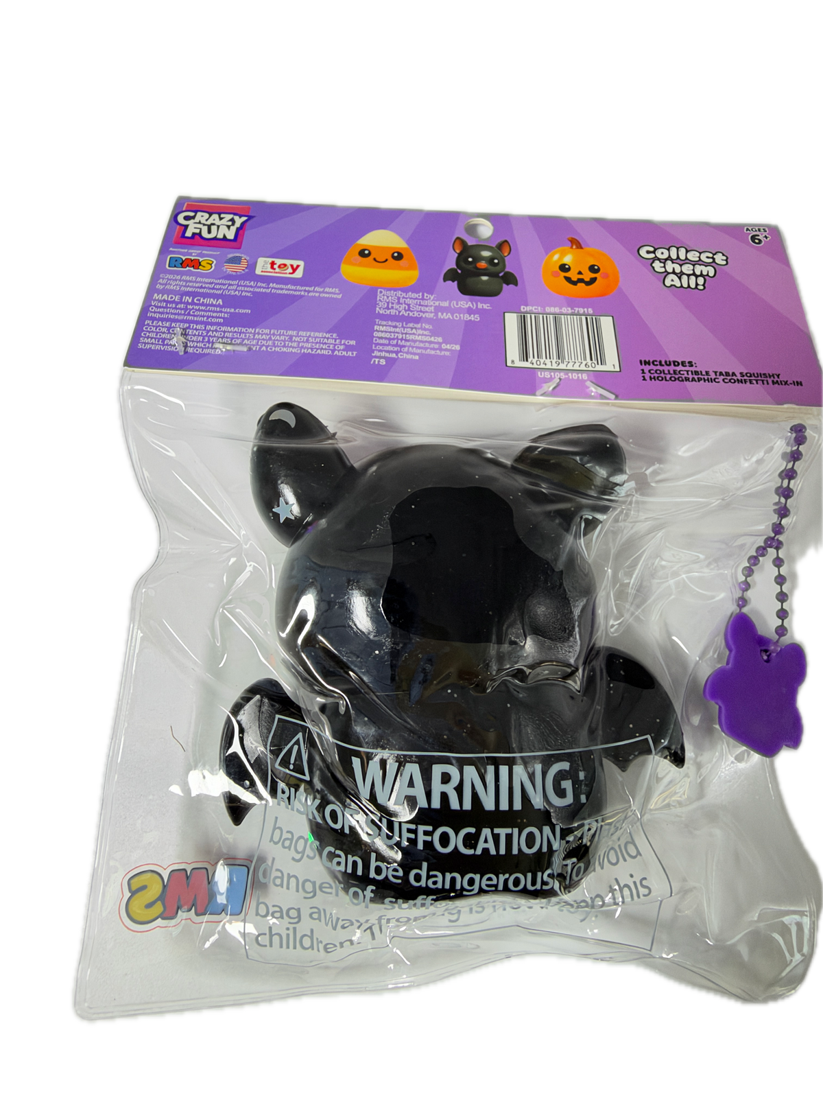 A 2M1 brand 'Crazy Fun' black cat collectible toy in its original clear plastic packaging with a purple header card. The toy is a glossy black cat figure with a purple ball chain and purple paw-shaped tag.