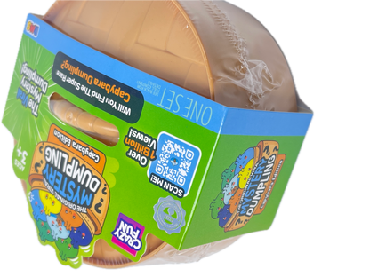A toy capsule mystery dump package from Crazy Fun, featuring a brown plastic capsule partially wrapped in clear plastic, with a bright green and blue cardboard sleeve displaying product graphics and a QR code.
