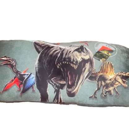 Decorative pillow with dinosaur illustrations on a light green background