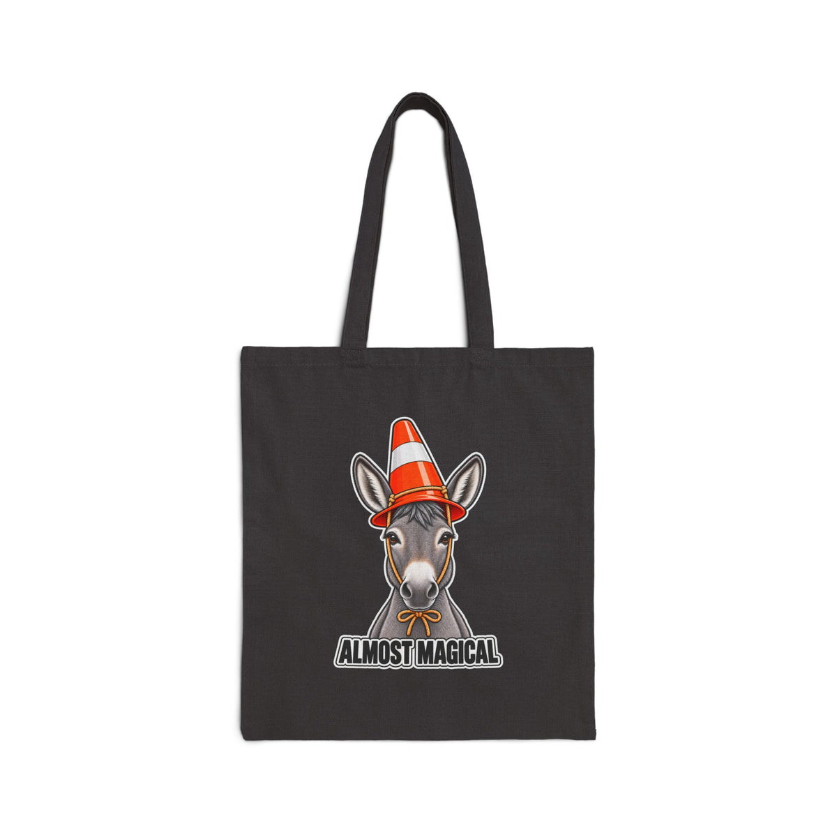 A black canvas tote bag with a graphic of a donkey wearing an orange and white striped traffic cone hat, with the text 'ALMOST MAGICAL' below it, shown on a plain white background.