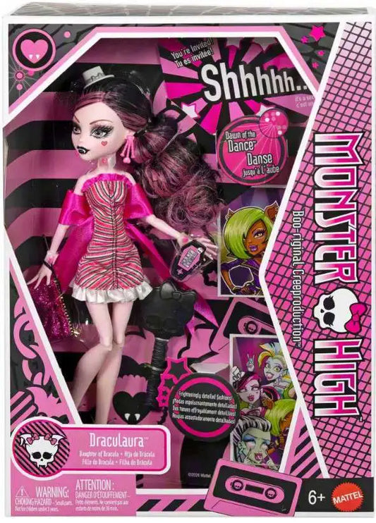 Monster High Draculaura 6-inch collectible doll in its original retail packaging, featuring a pink and black striped dress, purple hair, and accessories including a purse and hair stick.
