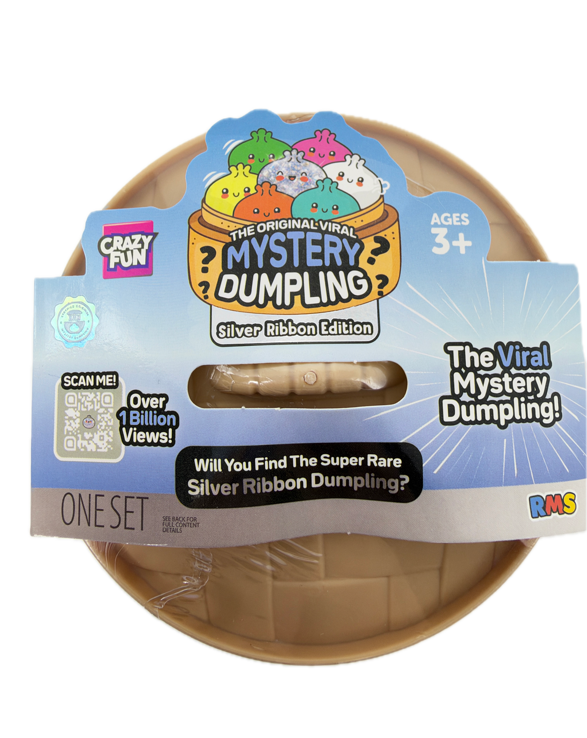 A packaged toy product labeled 'The Viral Mystery Dumpling!' with a blue and white paper sleeve and a beige plastic dumpling visible through a clear window. The package includes branding such as 'Crazy Pets' and 'The Original Witty Mystery Dumpling!' with a 'One Set' label.