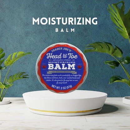 Head to Toe moisturizing balm container with plants and a blue wall background