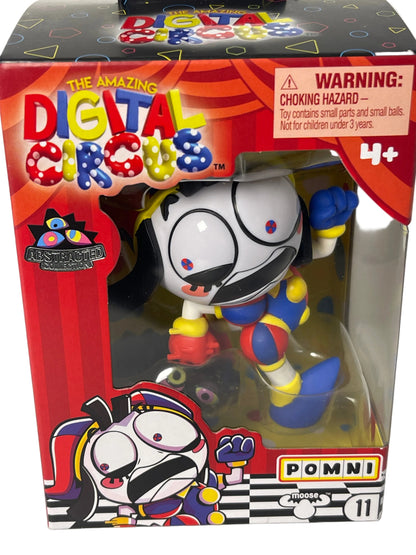 Toy figure in a colorful box with cartoon design, featuring the brand 'Pommi'.