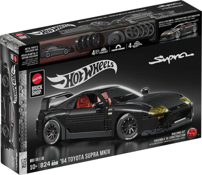 Hot Wheels Brick Shop '94 Toyota Supra Mk IV building set box, showing a black toy car with red interior and yellow headlights on a black background with Hot Wheels branding.