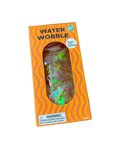 Orange packaging of a water wobble toy on a wooden surface