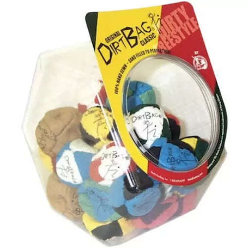 A clear plastic hexagonal container filled with colorful Dirt Bag Classic golf tees, with a yellow and red branded hang tag attached at the top, photographed on a white background.