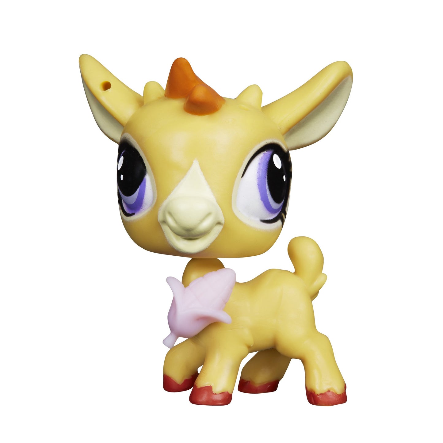 Toy figurine of a yellow creature with large eyes on a white background
