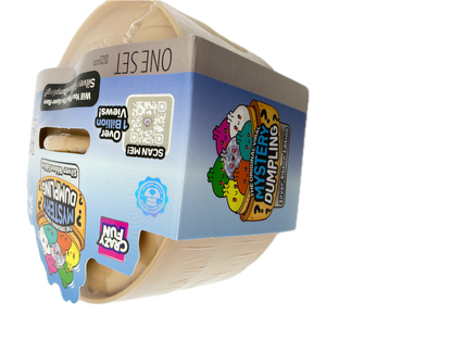 A Cuddly Fun brand 'Mystery Dumpying' one-set toy package, showing a beige plastic container partially visible through clear wrapping with colorful cartoon graphics and product details on the cardboard sleeve.