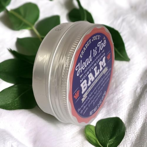 Balm container with a label on a white background with green leaves