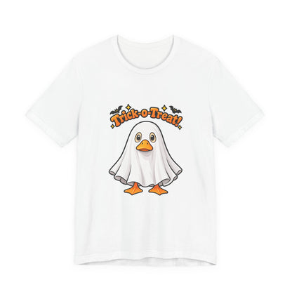A white short-sleeve crewneck t-shirt featuring a cartoon graphic of a ghostly duck with orange beak and feet, under the text 'Trick or Treat!' in orange with small black bats.