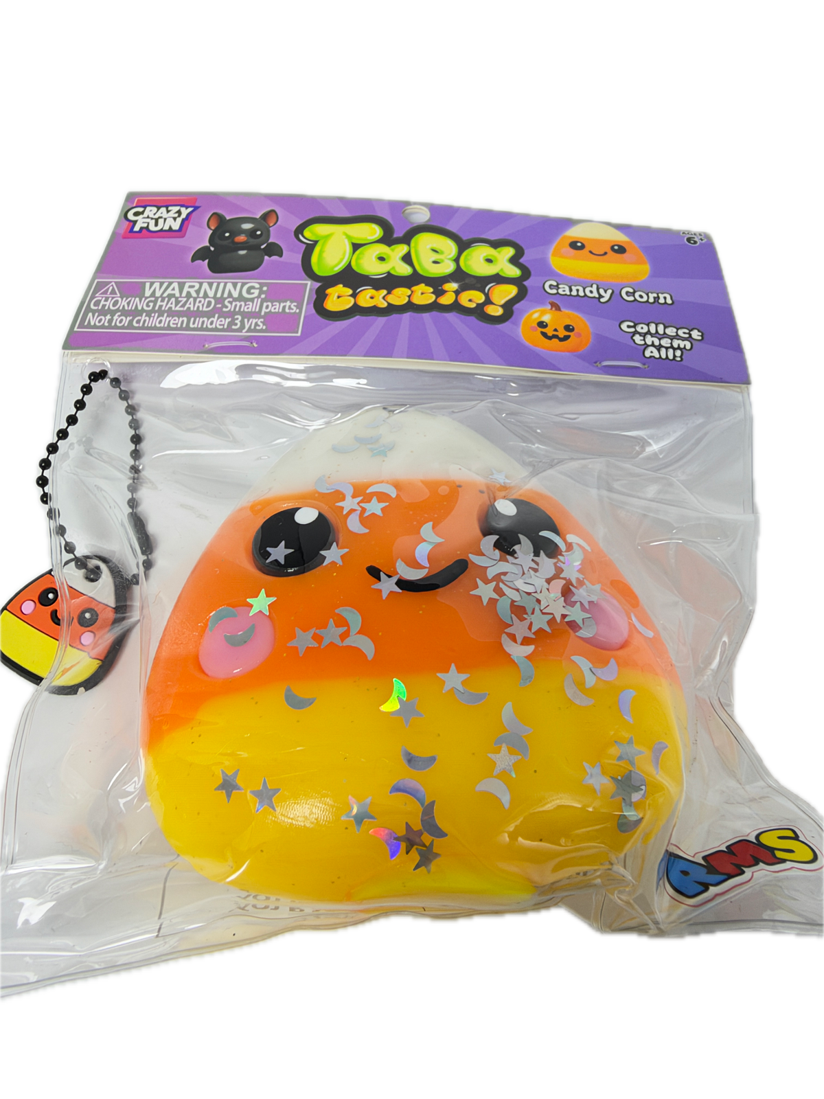 A packaged squishy toy shaped like a crescent moon with a black cat face, decorated with silver glitter stars and a pink crescent moon. The toy is sealed in a clear plastic bag with a purple 'Treats Squeezies' branded card insert.
