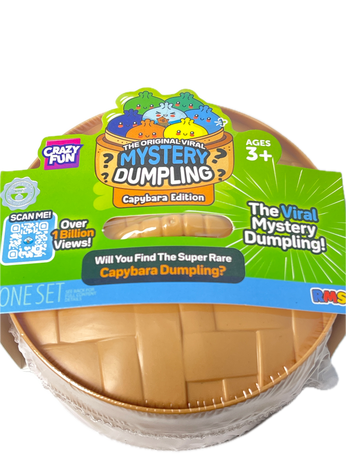 A Capybara Edition 'The Viral Mystery Dumping!' toy set in its retail packaging, featuring a brown woven basket-like container wrapped in clear plastic with a colorful green, blue, and orange cardboard insert.