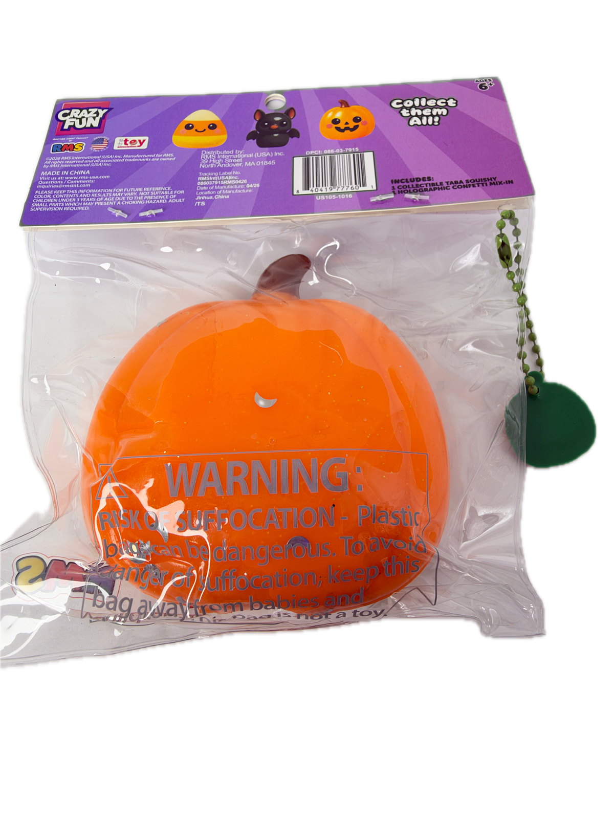 An orange squishy toy shaped like a pumpkin, sealed in a clear plastic bag with a purple printed backing card. The toy has a small brown stem and a green ball keychain attached by a metal chain.