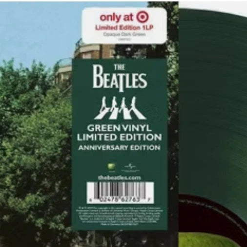 Green vinyl record with 'The Beatles' branding and a label indicating it's a limited edition release.