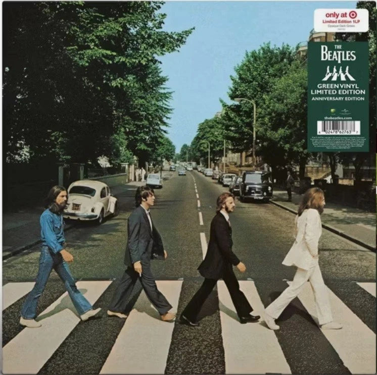 Album cover of The Beatles' 'Abbey Road' with four band members crossing the zebra crossing.