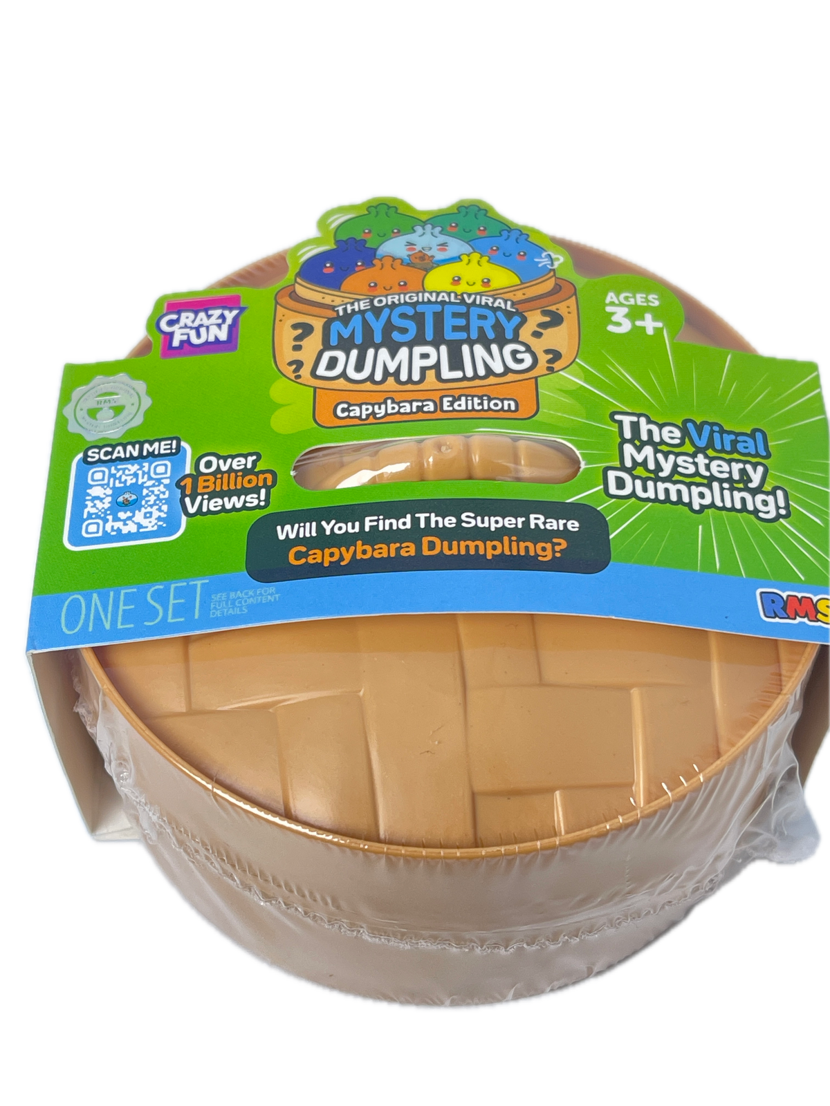 A packaged toy product labeled 'The Mint Mystery Dumping!' with a green and blue cardboard hanger card and a clear plastic wrap around a round beige/tan object inside a clear container. The packaging prominently shows the brand 'Crazy Pan' and product line text.