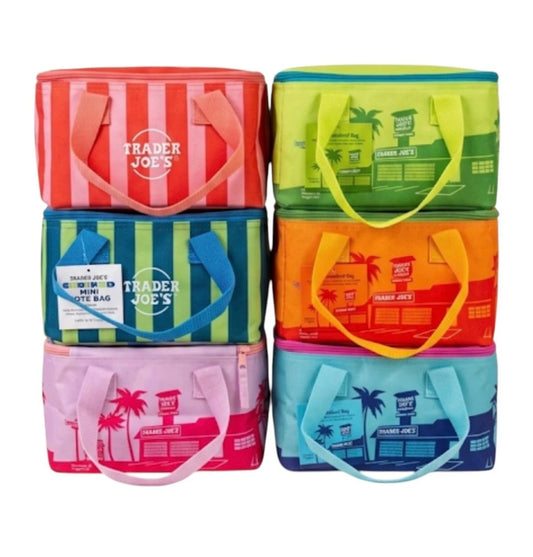 Stack of colorful tote bags with 'Trader Joe's' branding on a white background
