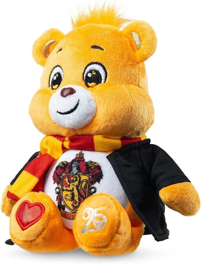 Plush toy lion wearing a shirt with a crest and shorts on a white background