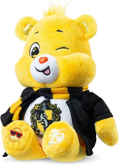 Yellow plush toy with a black and white outfit featuring a crest on a white background