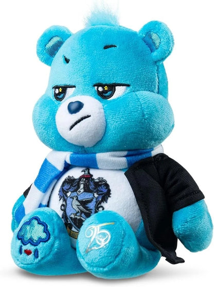 Blue teddy bear plush toy with a white shirt featuring a logo on a white background