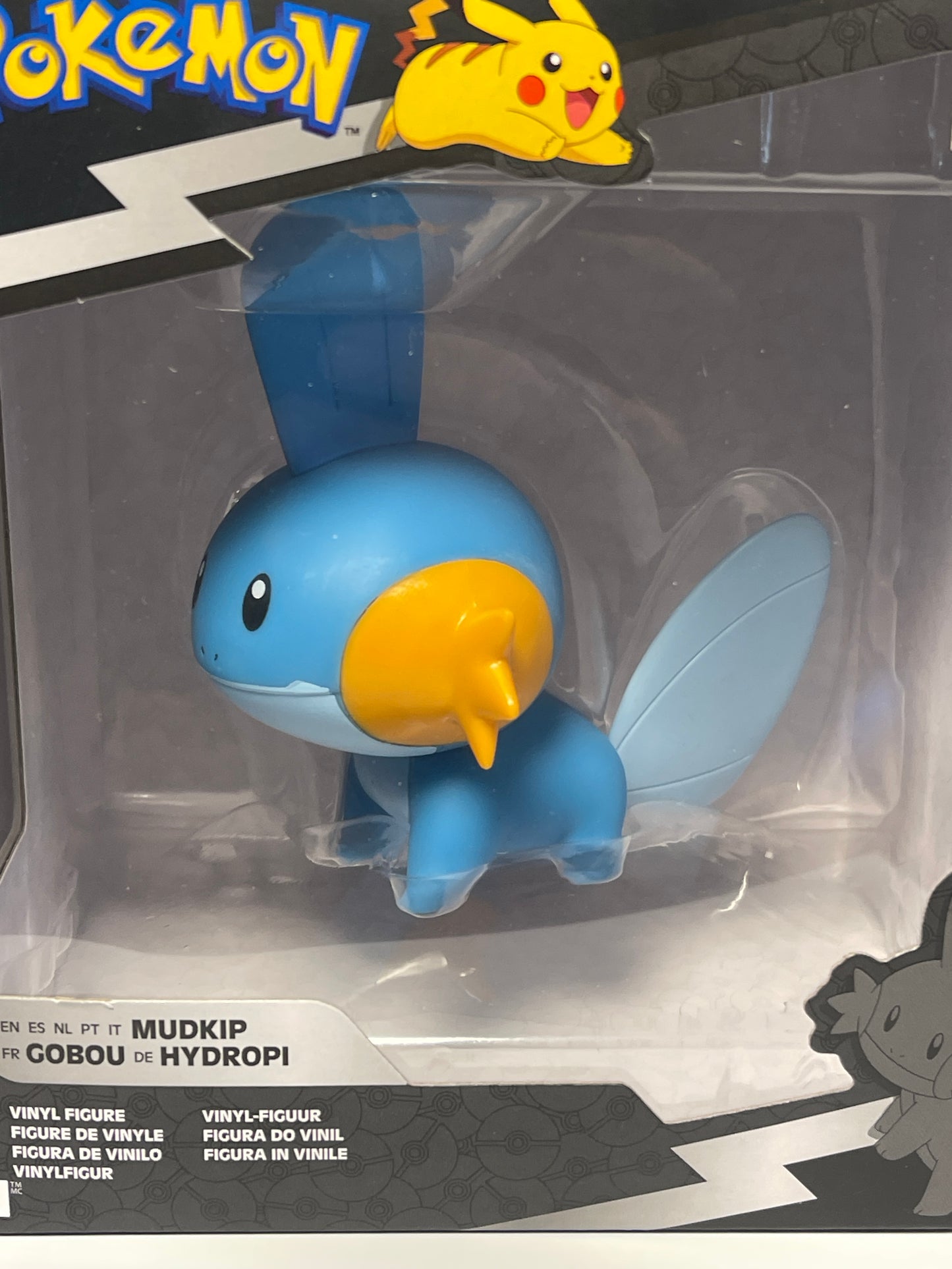 Blue and yellow rubber duck toy in packaging with Pokémon branding.