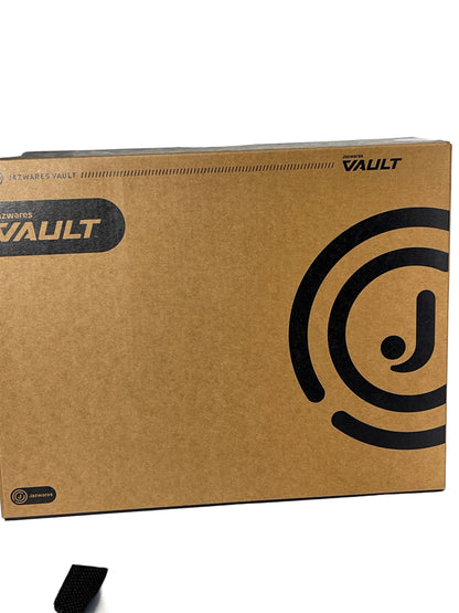 A brown cardboard box for Enigma Vault software, featuring black printed logos and text, photographed on a white surface.