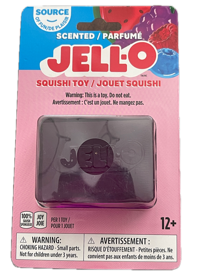 Jell-O Squishi Toy in its original pink and blue cardboard packaging, featuring a translucent purple square squishy toy inside a clear plastic window.