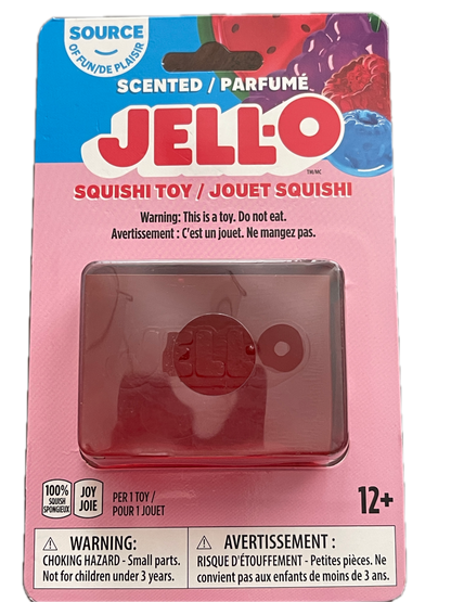 Jell-O Scented Squishy toy in its original pink and blue blister packaging, featuring a translucent pinkish-red squishy toy inside a clear plastic window.