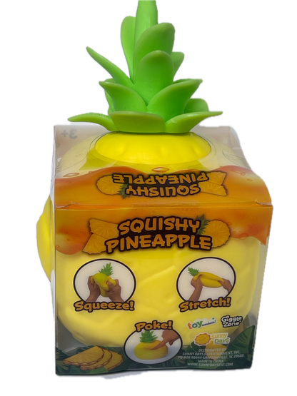 A packaged squishy pineapple toy with a bright yellow body, green leafy top, and printed packaging showing squeeze and poke instructions, isolated on a white background.