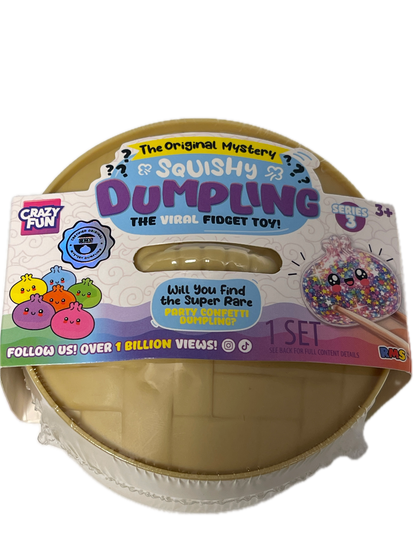 A Crazy Fun Squishy Dumpling mystery toy set in its original packaging, featuring a beige plastic container with a colorful printed label.