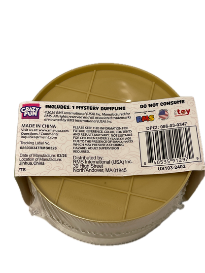 A plastic toy bucket with a tan interior and a clear outer wall, wrapped in a clear plastic sleeve with a white product label attached. The label shows a barcode, product details, and the 'Crazy Fun' brand logo.