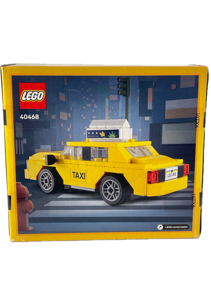 LEGO City Taxi set 40468 in its original yellow and blue packaging box, showing the assembled yellow taxi on the front.