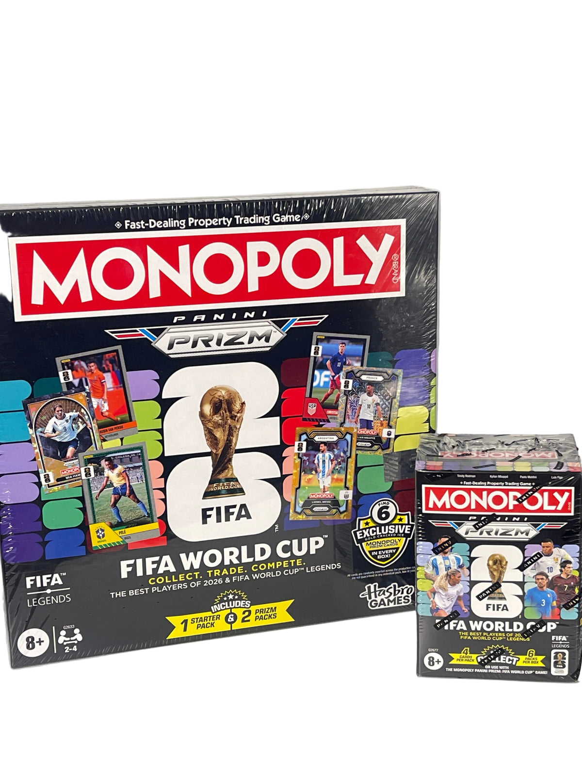 A Monopoly Panini FIFA World Cup trading card game box displayed next to a smaller matching booster pack on a white surface against a white wall.