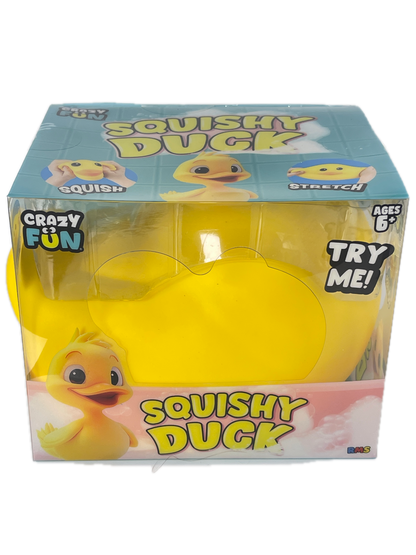 A packaged yellow squishy duck toy in clear plastic blister packaging with a blue and pink printed box. The box shows the text 'Squishy Duck', 'Crazy Fun', and 'Try Me!'.