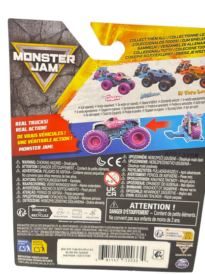 The back of a Monster Jam toy packaging box, showing product details, warning labels, and a colorful illustration of monster trucks on a black background.