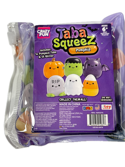A sealed retail package of Tabaz Squeezes Pumpkin blind bag toys, showing the front and back of the purple cardboard insert with character graphics and a barcode. The clear plastic bag contains small squeeze toys peeking out.
