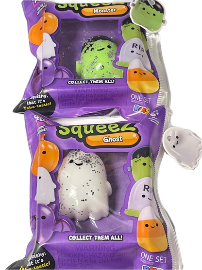 Three purple mystery squishy toy packages from Tinsley Toys, featuring ghost and monster designs, with one white ghost squishy visible in the center package.