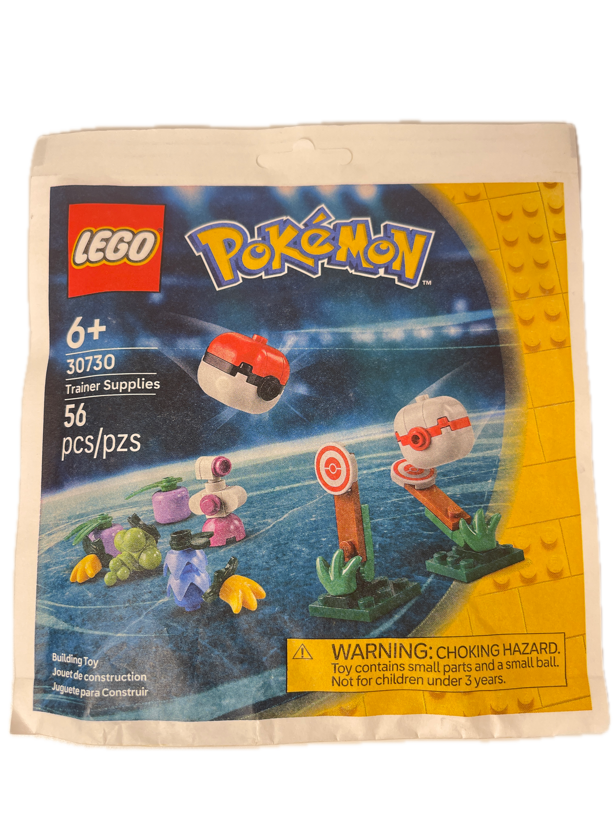 A sealed LEGO toy package for the LEGO Pokémon Travel Supplies set 30759, featuring a colorful printed insert card with LEGO and Pokémon branding, age 6+, 36 pieces, and a choking hazard warning on a white plastic bag.