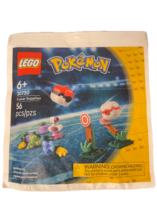 A sealed LEGO toy package for the LEGO Pokémon Travel Supplies set 30759, featuring a colorful printed insert card with LEGO and Pokémon branding, age 6+, 36 pieces, and a choking hazard warning on a white plastic bag.