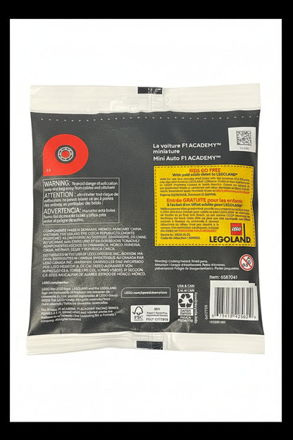 Back of a LEGO F1 Academy Mini Auto vehicle packaging bag, showing product information, warning labels, a yellow kids go free coupon, barcode, and LEGO branding on a black background.