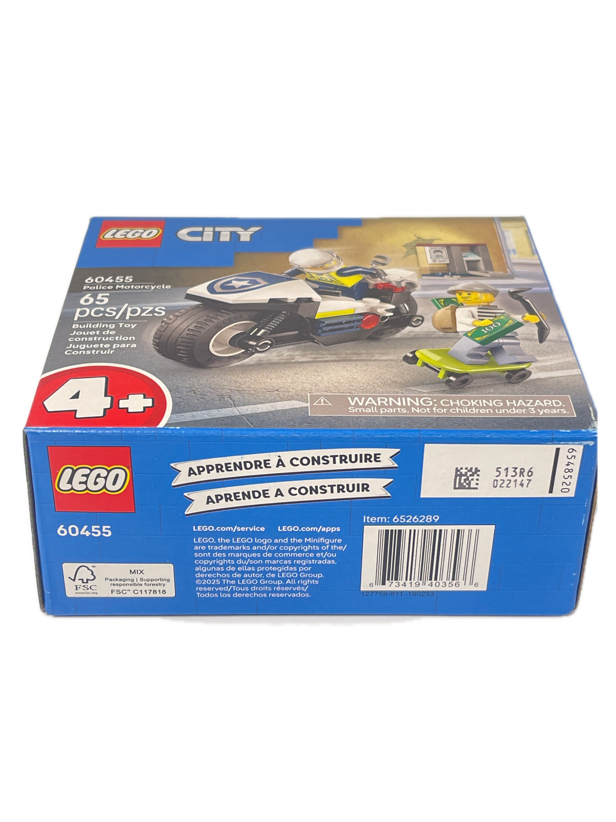 LEGO City police motorcycle building set box, showing the blue packaging with a photo of the assembled toy motorcycle on the front and product details on the side.