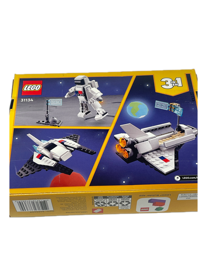 LEGO 31154 1-3 piece space station building set box, showing the front packaging with illustrations of the assembled white, gray, and black space station model against a dark blue starry space background.