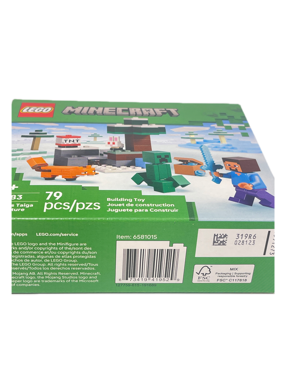 LEGO Minecraft toy building set box shown at an angle, displaying the green packaging with colorful blocky character illustrations and a barcode.