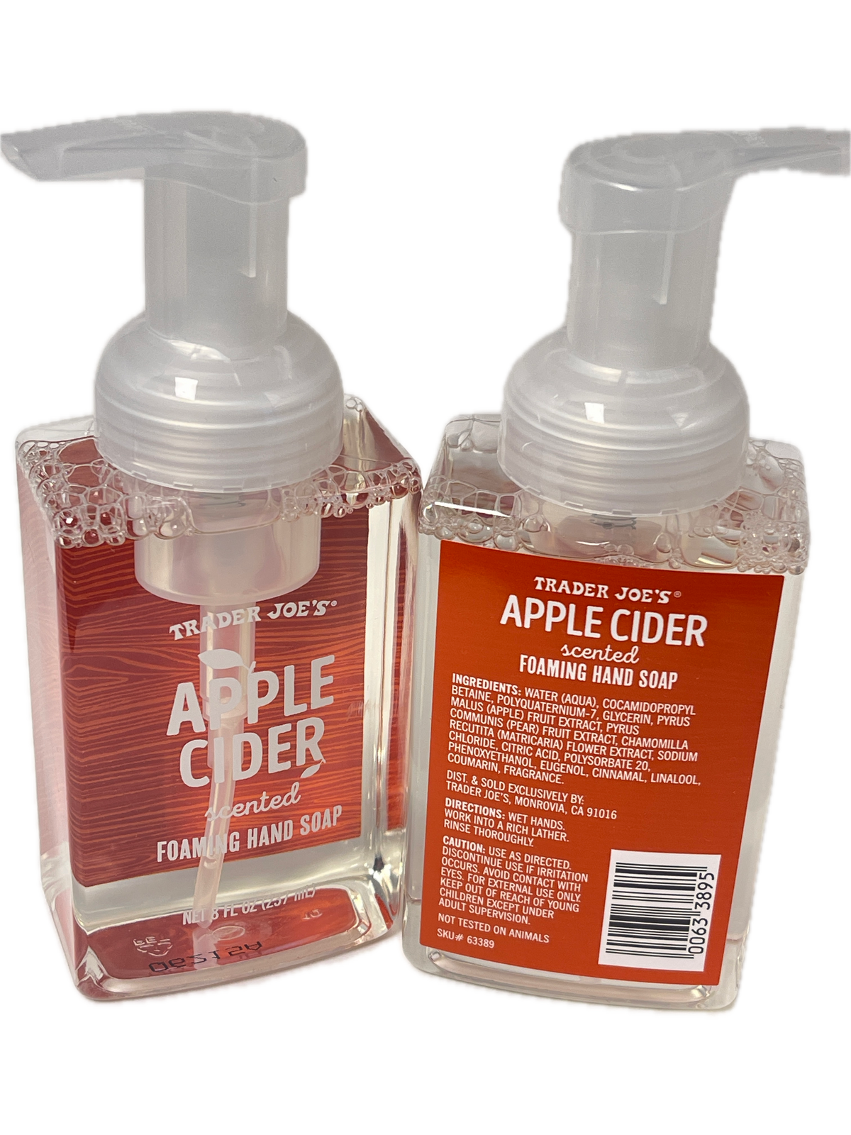 Two Trader Joe's Apple Cider foam hand soap bottles stacked vertically on a white background, showing the clear liquid, pump dispensers, and orange-red labels.
