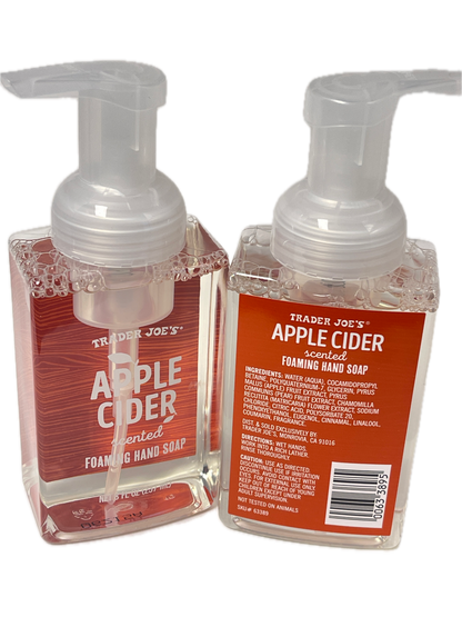 Two Trader Joe's Apple Cider foam hand soap bottles stacked vertically on a white background, showing the clear liquid, pump dispensers, and orange-red labels.